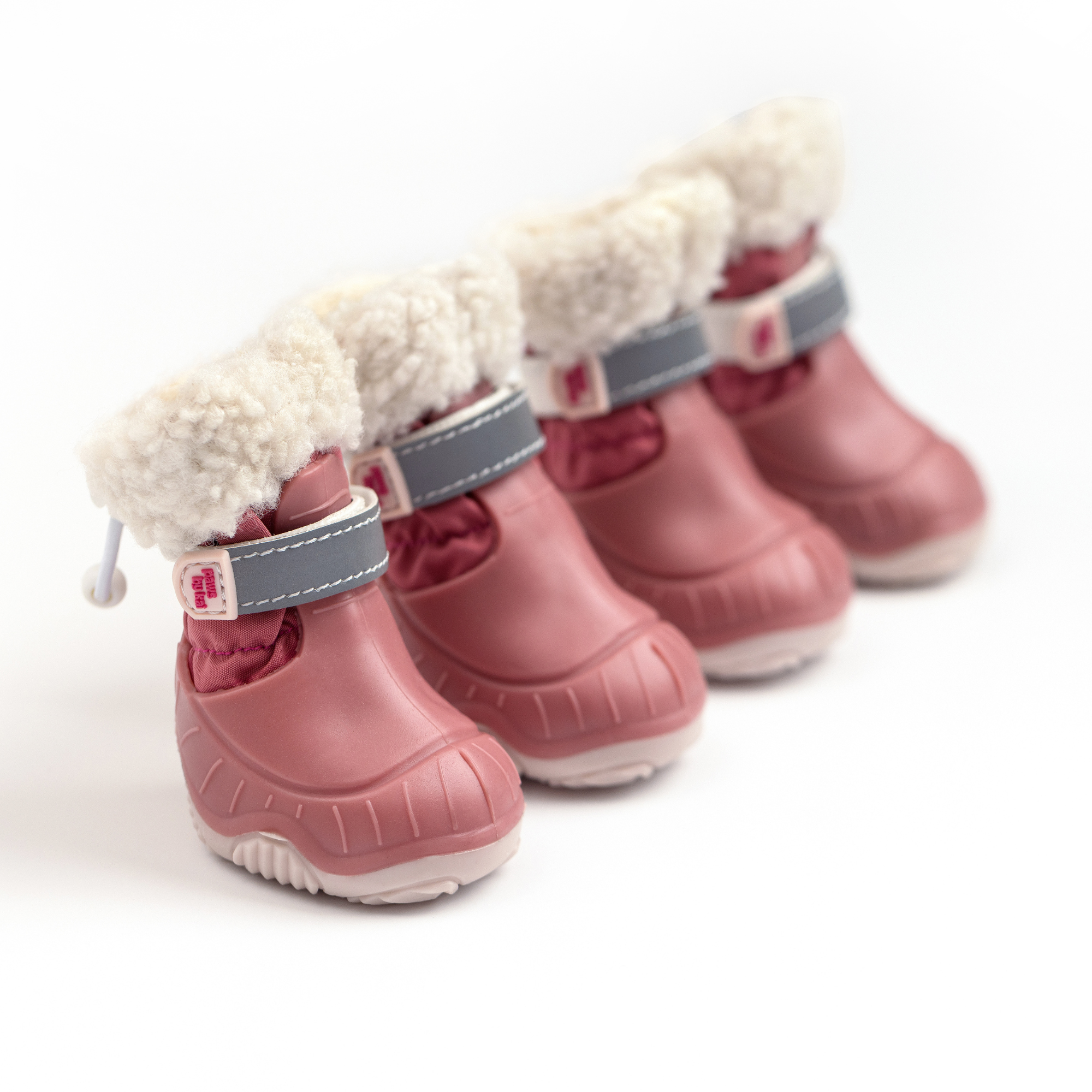 Pair of pink dog snow boots with cream fleece cuffs and gray-blue straps