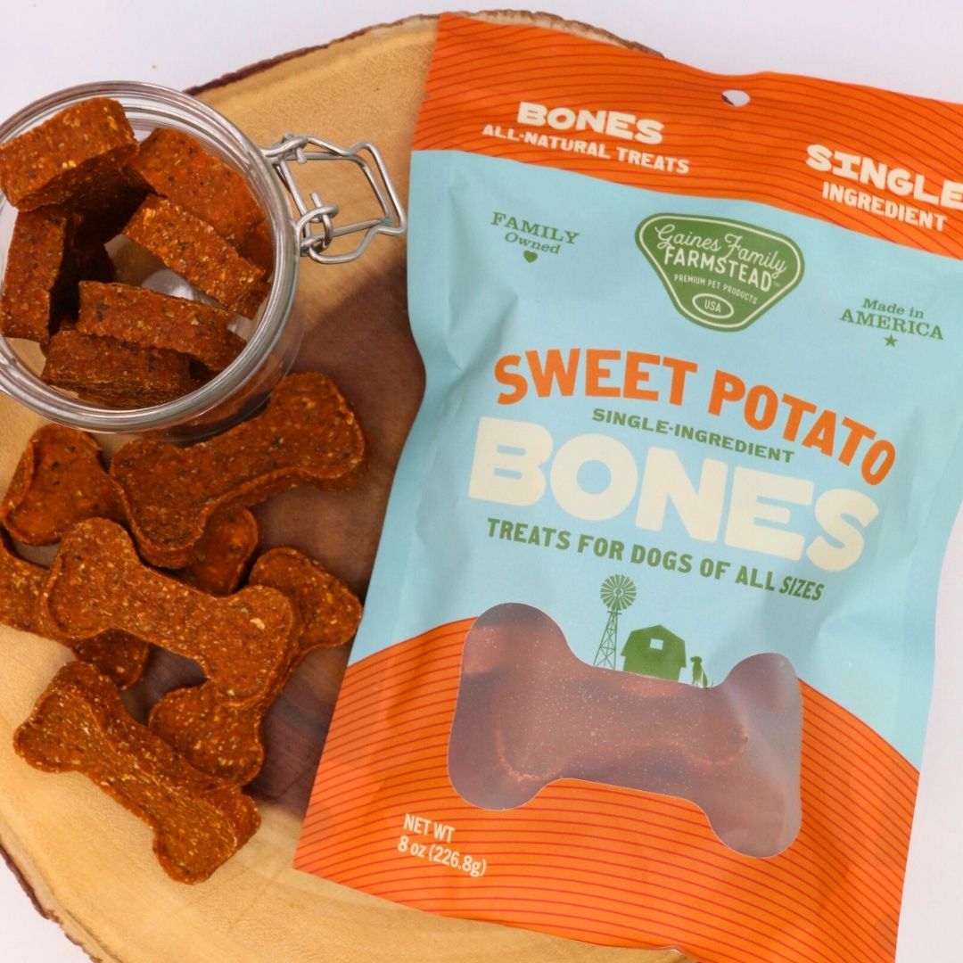 Sweet potato dog treat bones pouch with glass jar of bones on wood