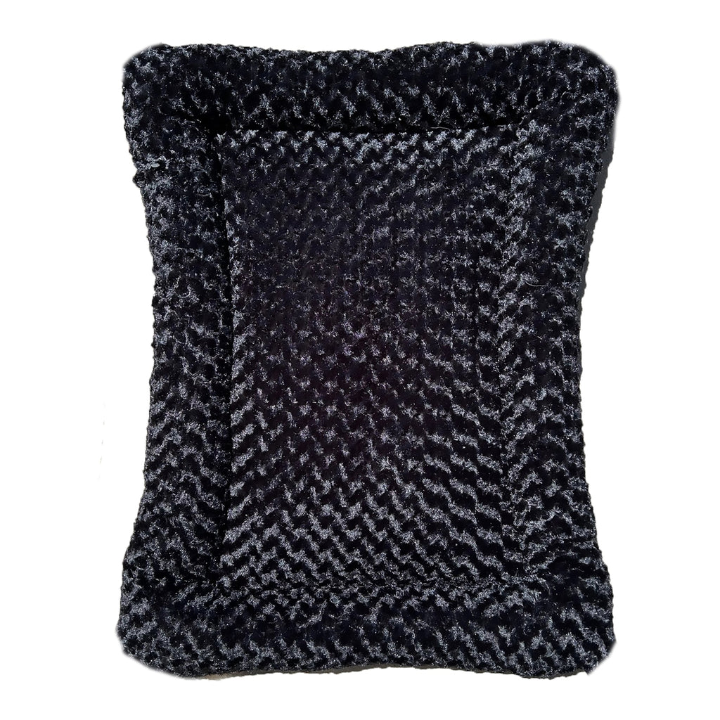 Black rectangular dog bed with thick bolstered sides and cloud-like faux fur cover