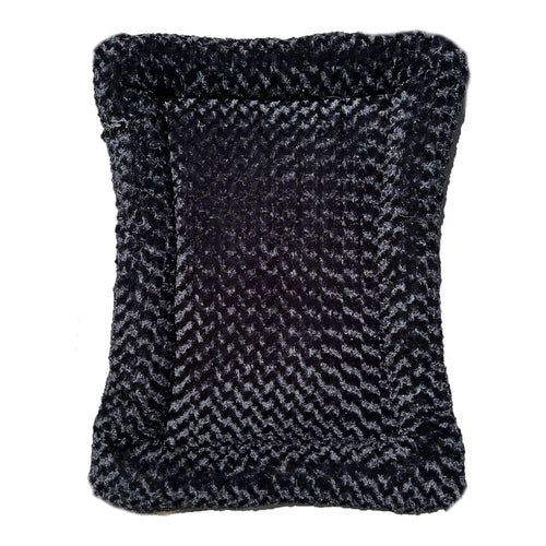 Black rectangular dog bed with thick bolstered sides and cloud-like faux fur cover