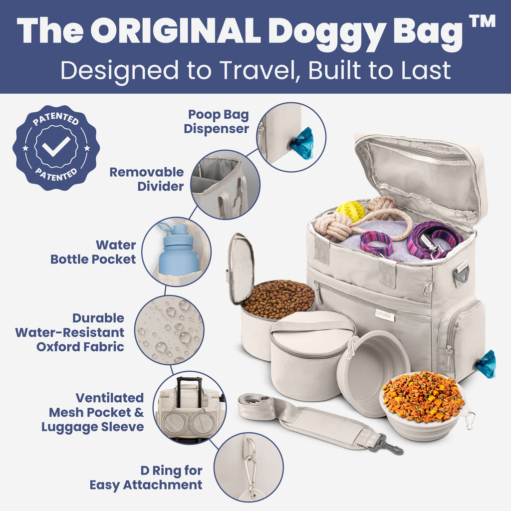 Gray dog travel bag with zipper pockets, mesh divider, and insulated food containers shown