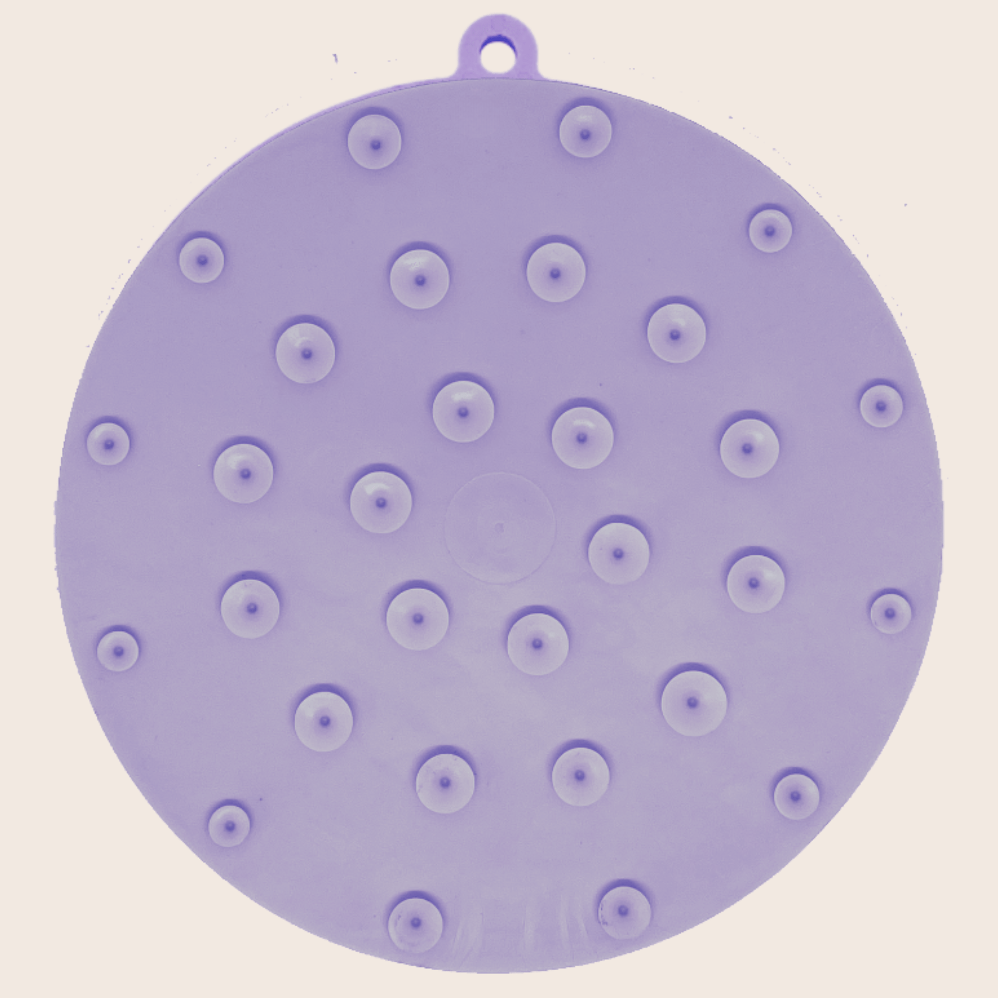 Purple round silicone lick mat with evenly spaced suction bump dots