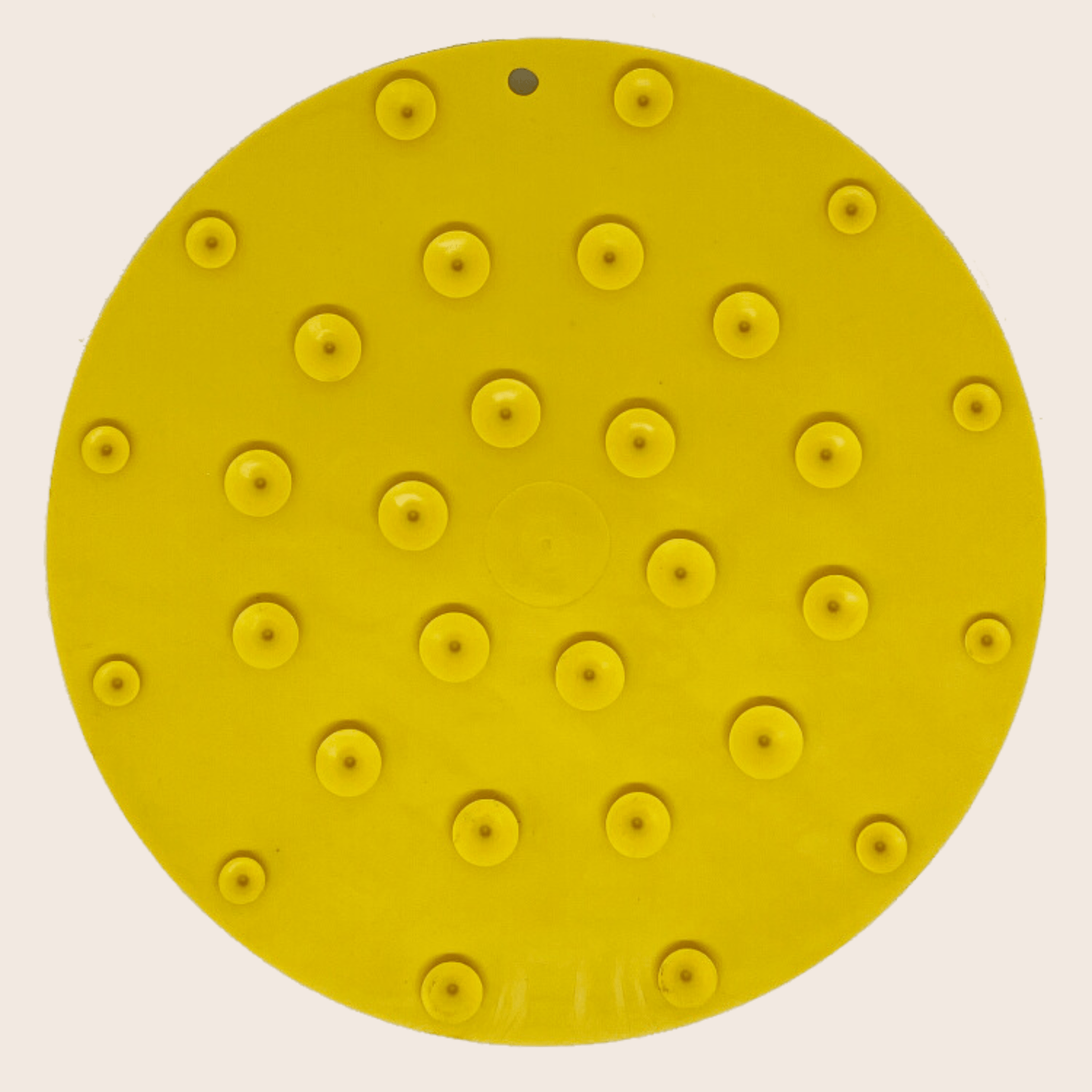 Yellow circular dog lick mat with small suction cup bumps pattern