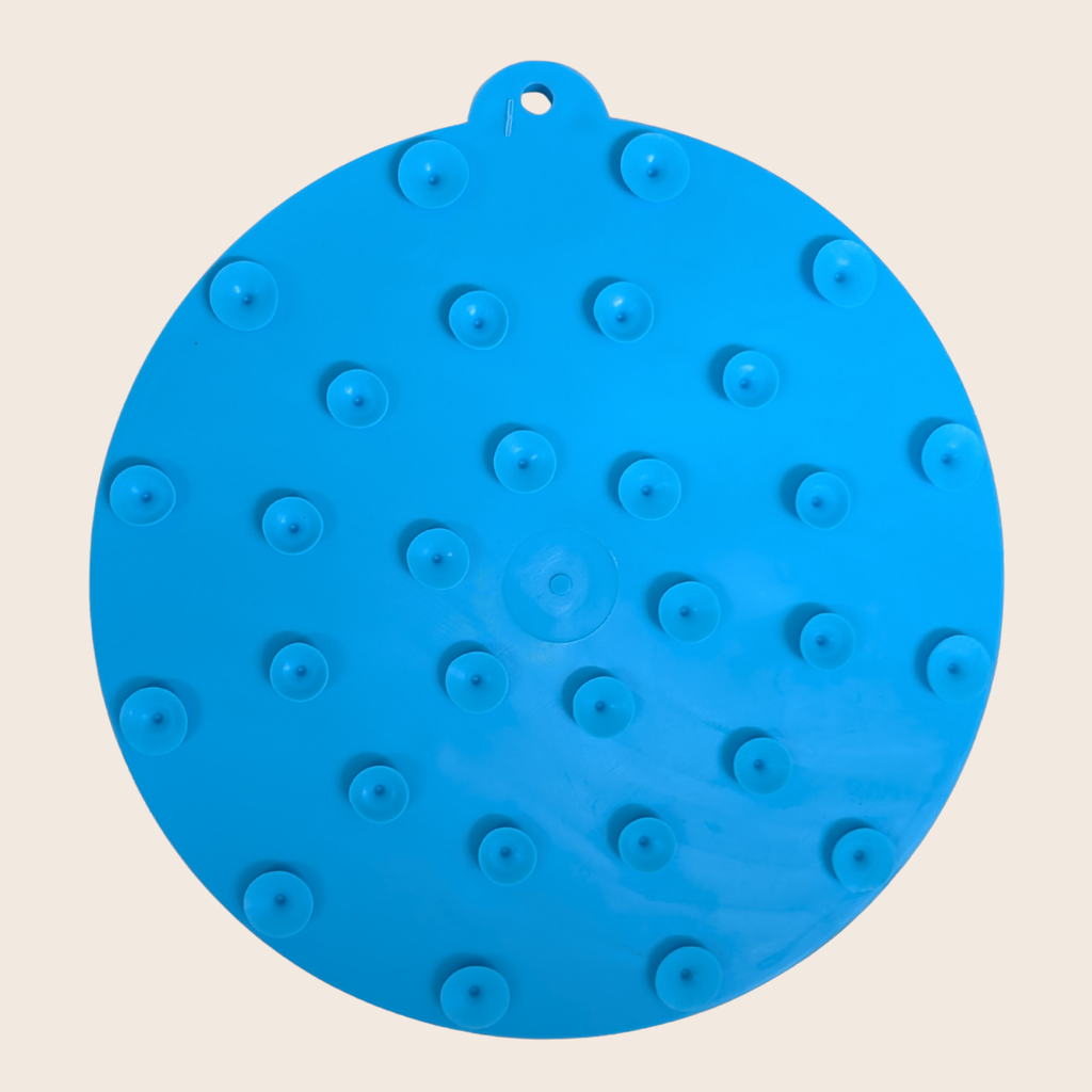 Blue round dog lick mat with suction cups and raised feeding bumps
