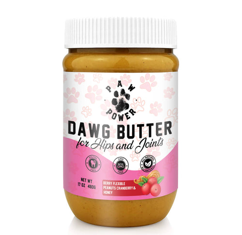 Dawg Butter dog supplement jar with white ribbed cap, pink label, golden paste inside