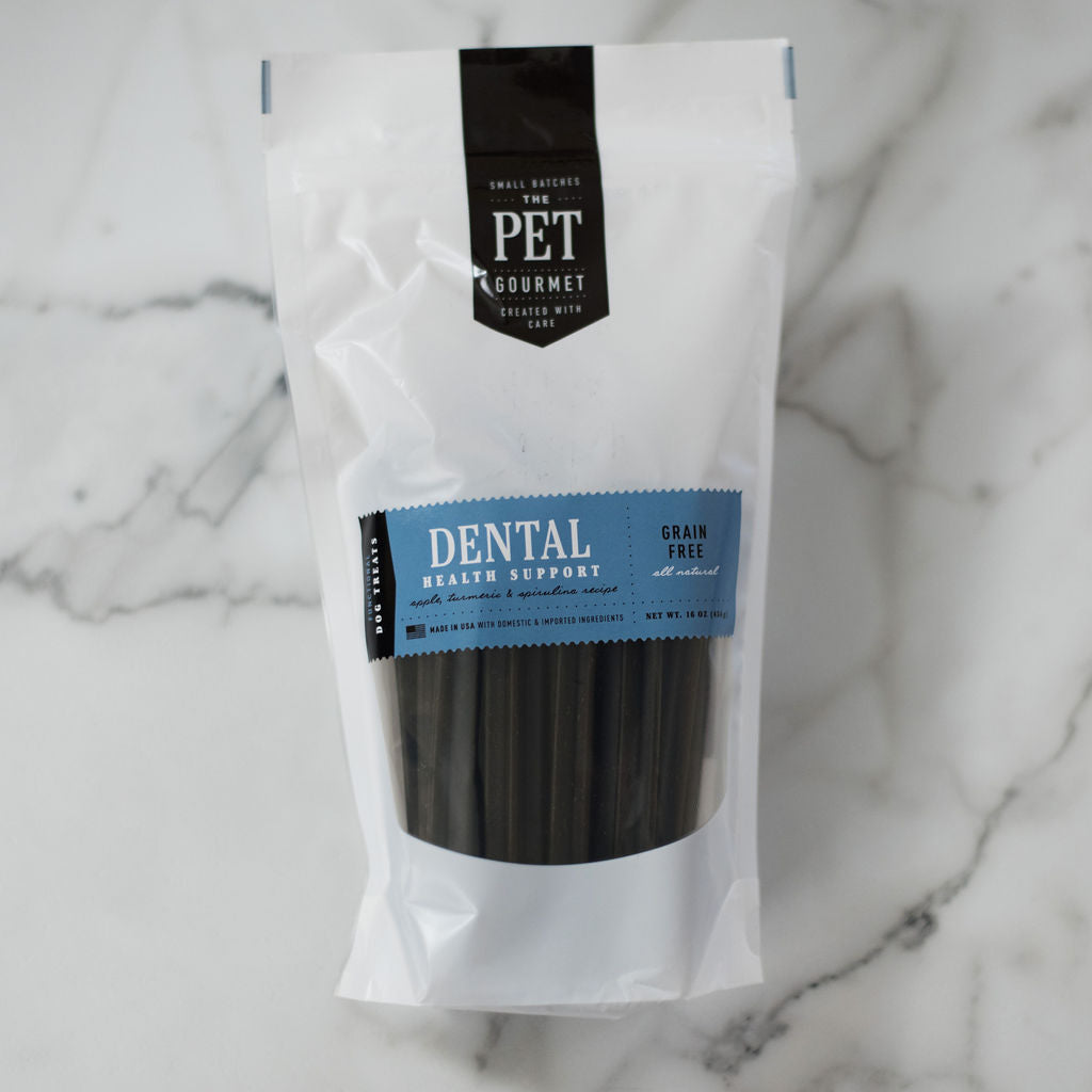 Dog dental chew sticks in white pouch, blue band label, grain-free