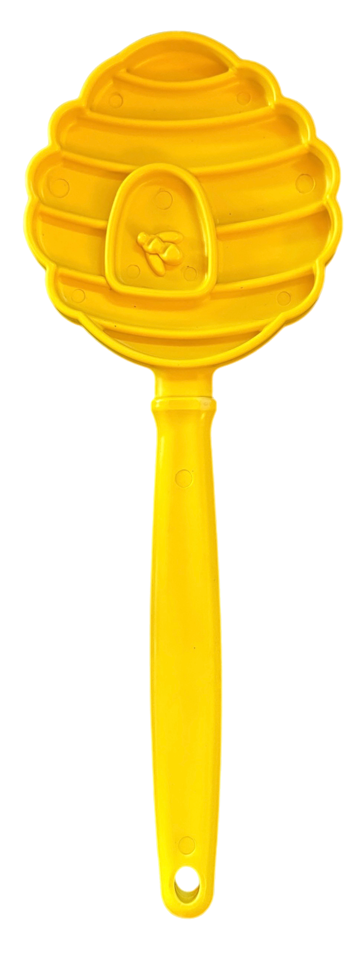 Yellow hand-held lick stick with raised honeycomb texture on a round head