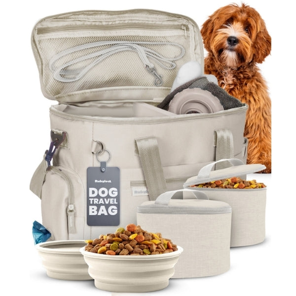 Beige dog travel bag with zipper top, mesh divider, and food bowls for supplies