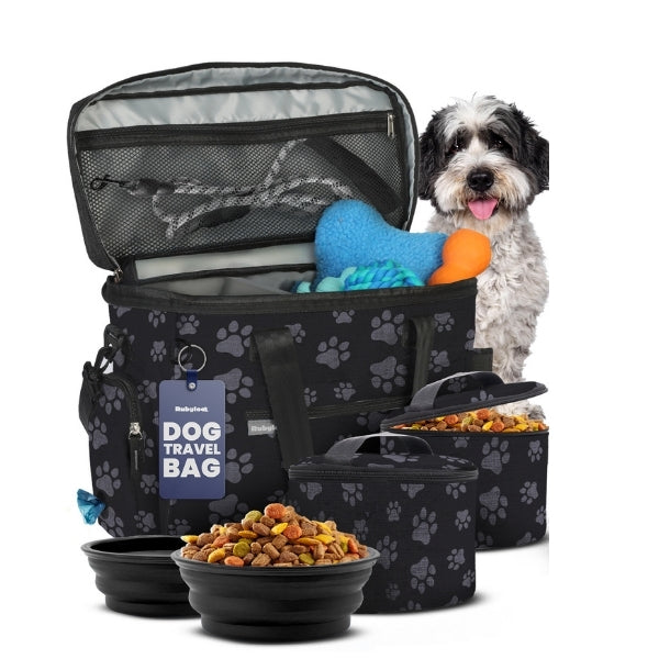 Black dog travel bag with paw-print fabric, open mesh top, and food bowls