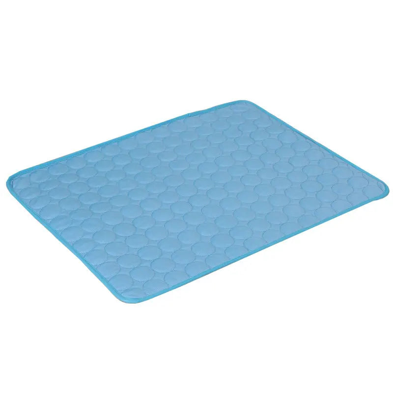 Blue dog cooling mat with smooth raised bubble texture, flat folded view