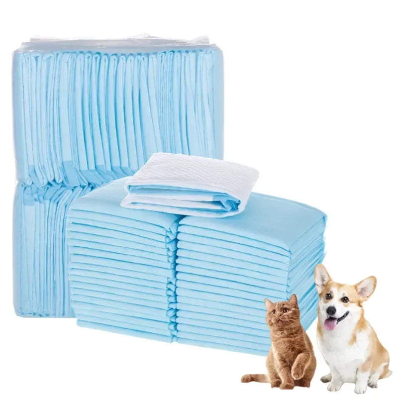 Stack of light blue disposable pet urine pads with neatly folded top pads
