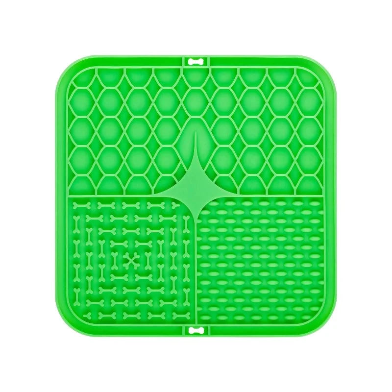 Green silicone lick mat with bone-shaped divider and raised grid plus dot channels