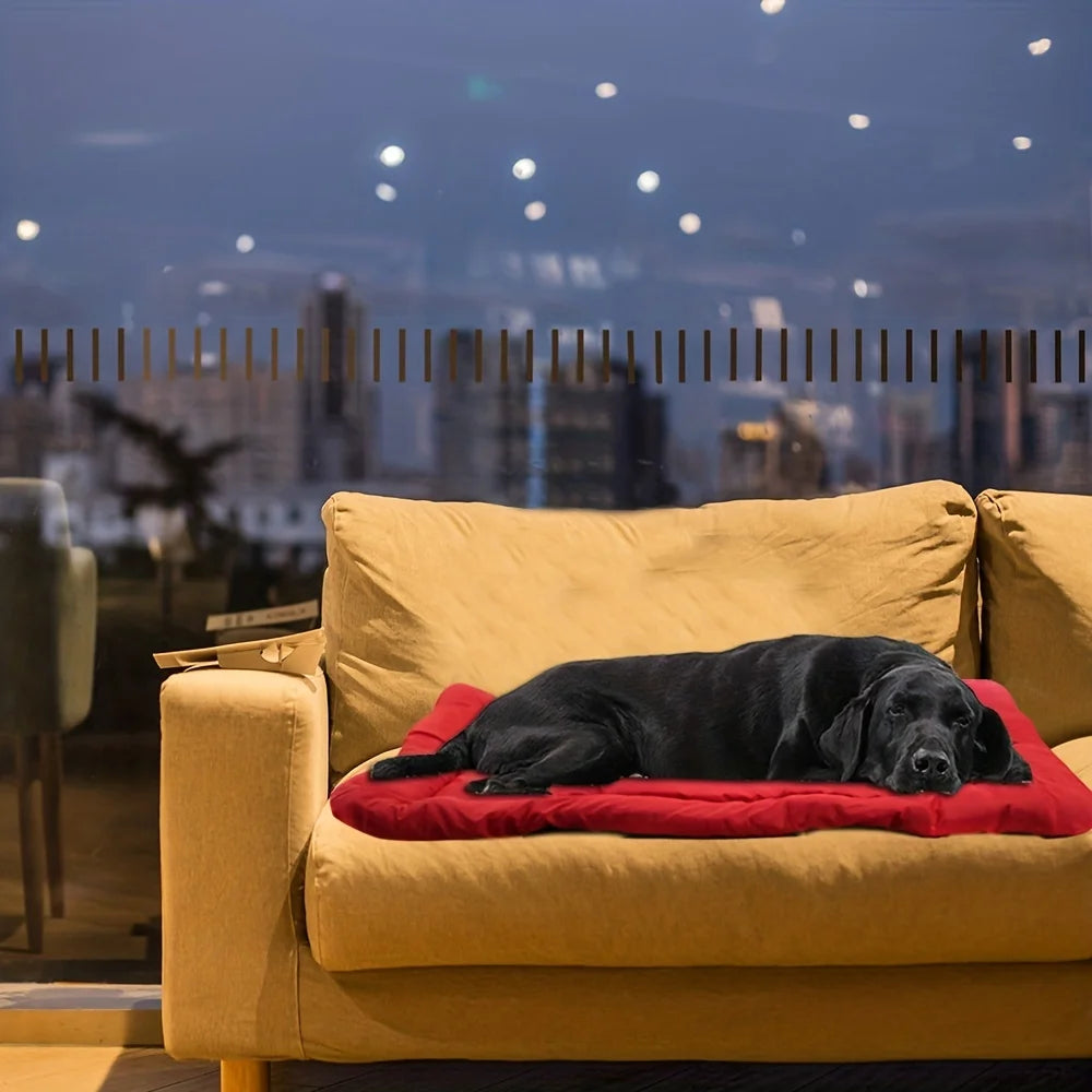 Pet bed cushion in red with thick padding, on a sofa for pets