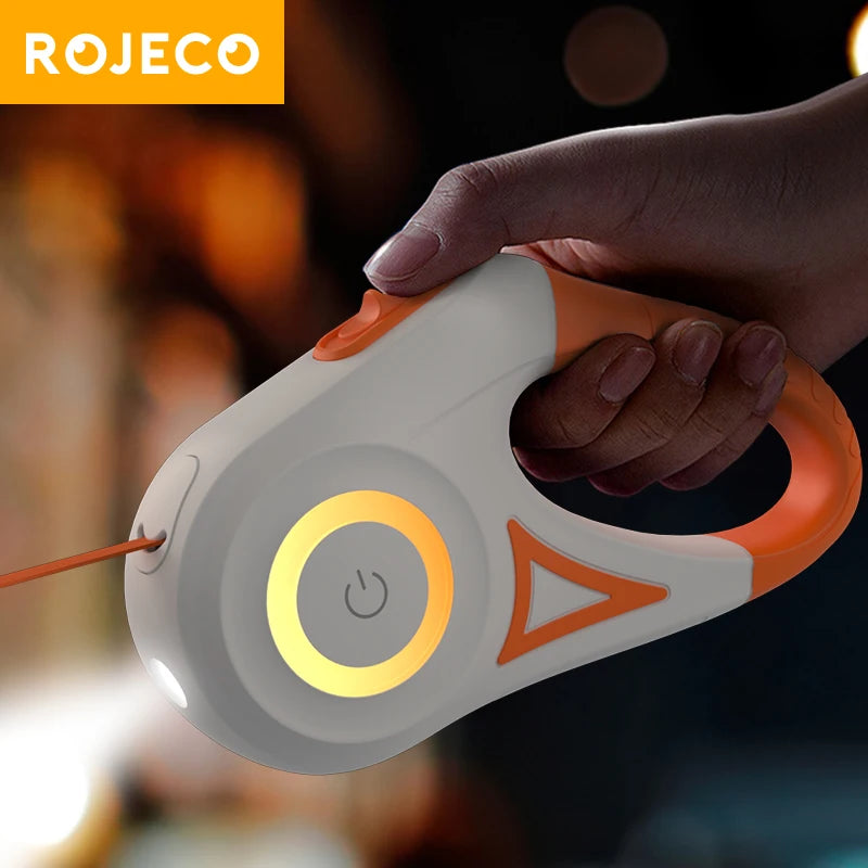 Retractable dog leash with orange button and glowing yellow LED light ring