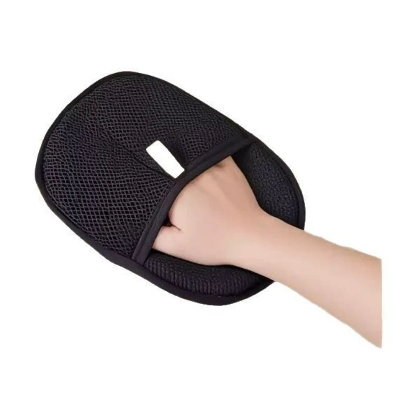 Pet hair remover glove with black textured mesh pad and white label tab