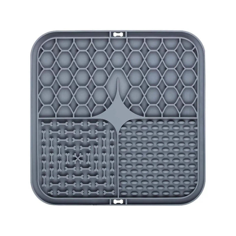 Gray silicone lick mat with bone-shaped divider and raised grid and dot channels