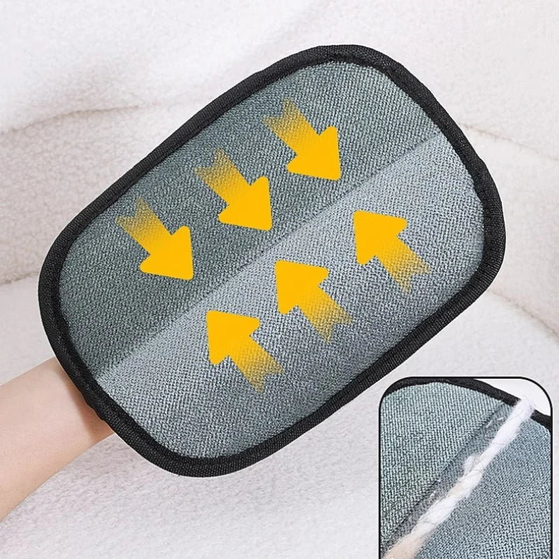 Pet hair remover glove with gray pad, black edge, and visible fur removal area