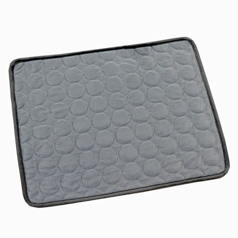 Gray dog cooling mat with raised bubble pattern and dark gray fabric edge trim