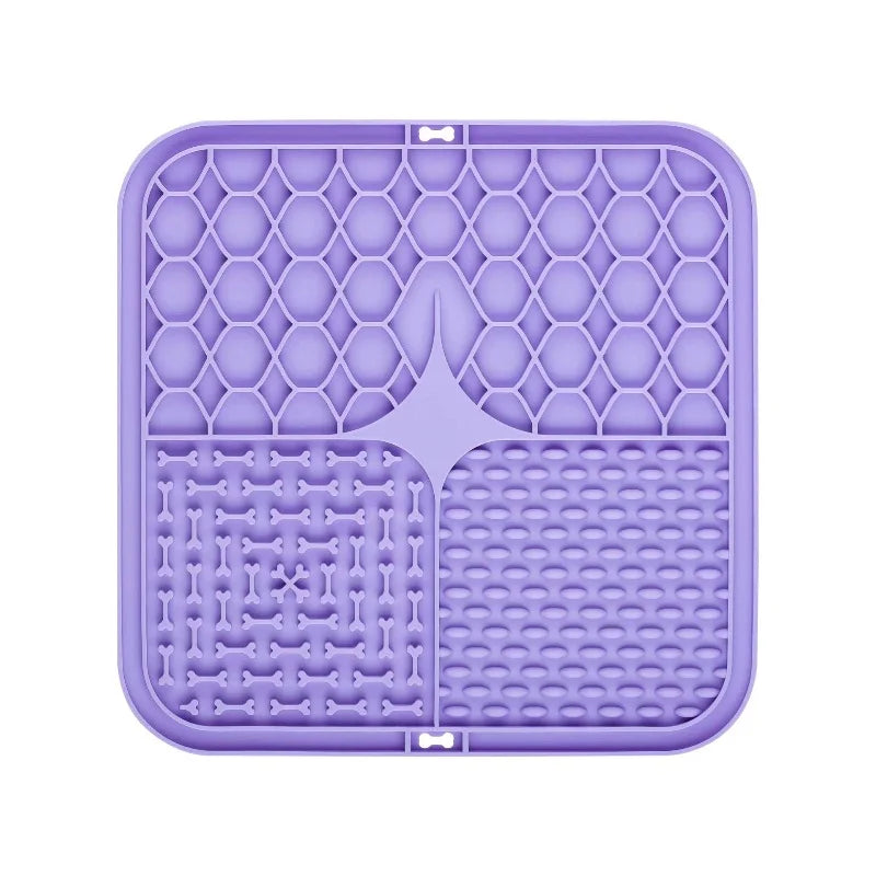 Purple silicone lick mat with bone-shaped divider, raised grid and dot channels