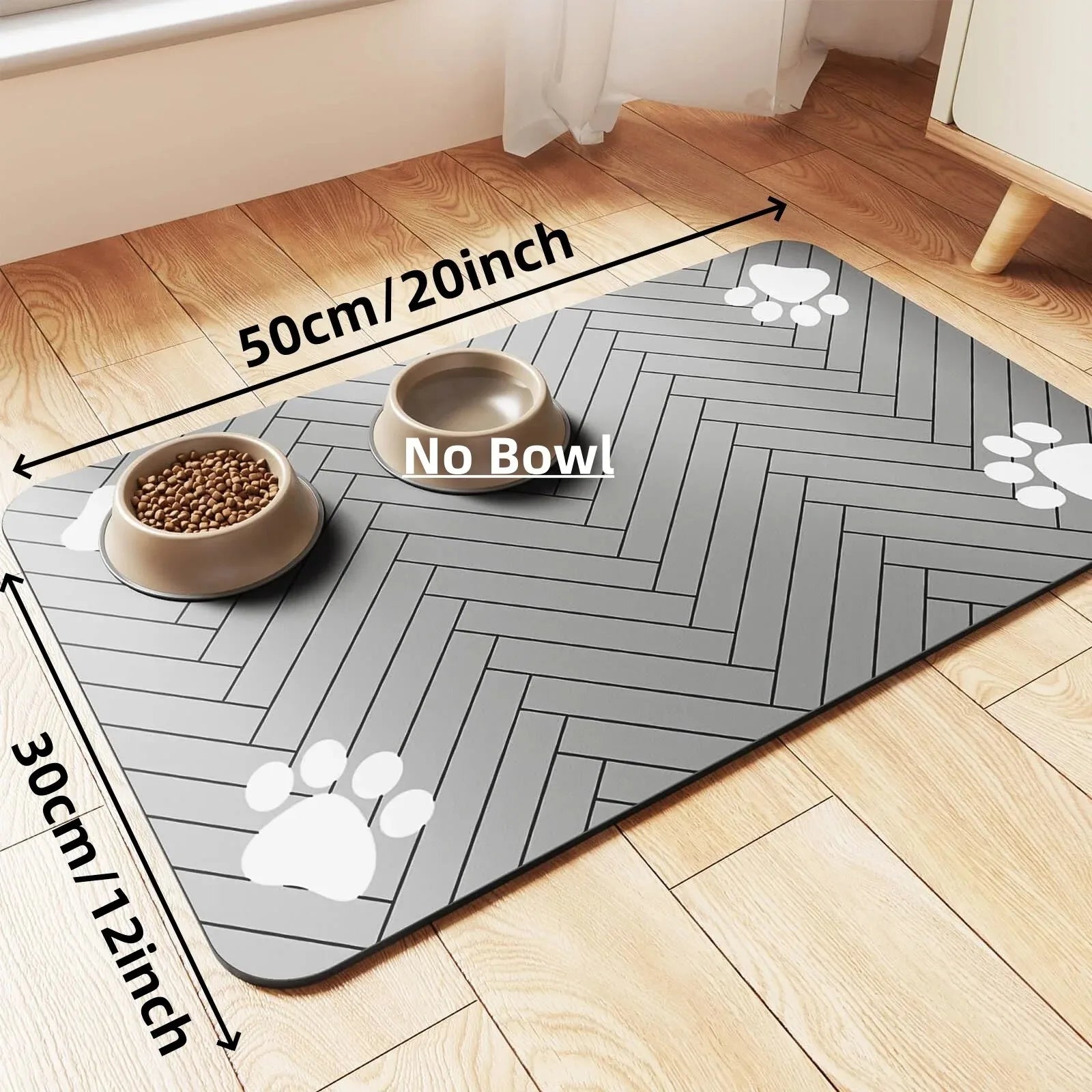 Rectangular dark grey pet feeding mat with white paw prints and two bowls placed on it