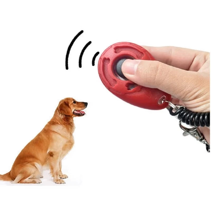 Red teardrop dog training clicker with finger-pressed button, black coiled strap and clip