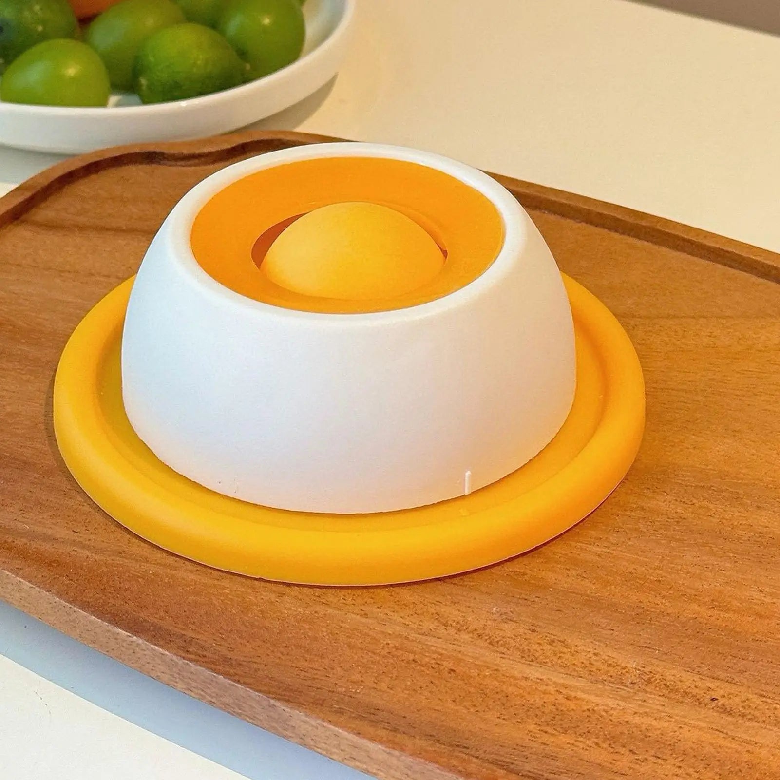 Slow feeder dog bowl with yellow base, white dome, and yellow center insert