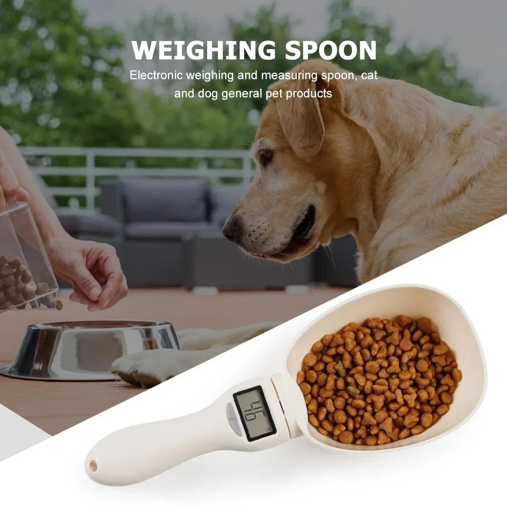 White electronic pet food measuring scoop with LCD screen, filled with brown kibble