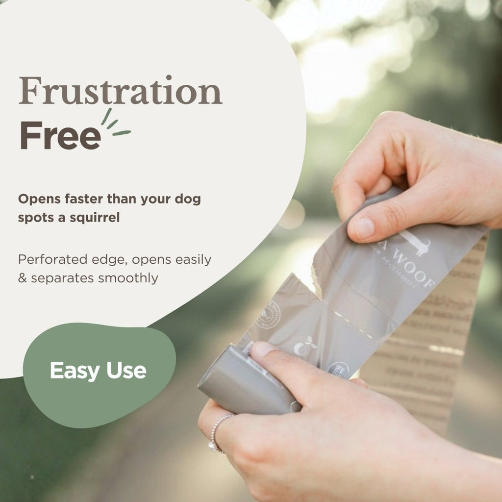 Hand holding a biodegradable dog waste bag with perforated opening visible.